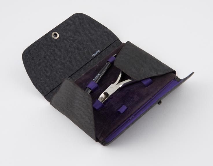 Corn razor and nail clippers in leatherette case