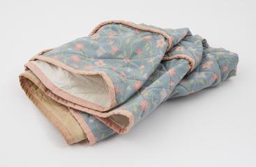 Quilted cover with floral design