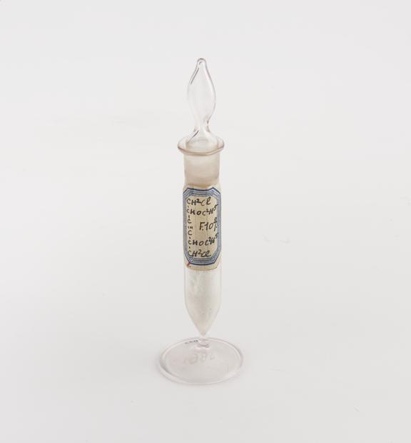 Glass specimen vial with glass stopper containing chloromethyl