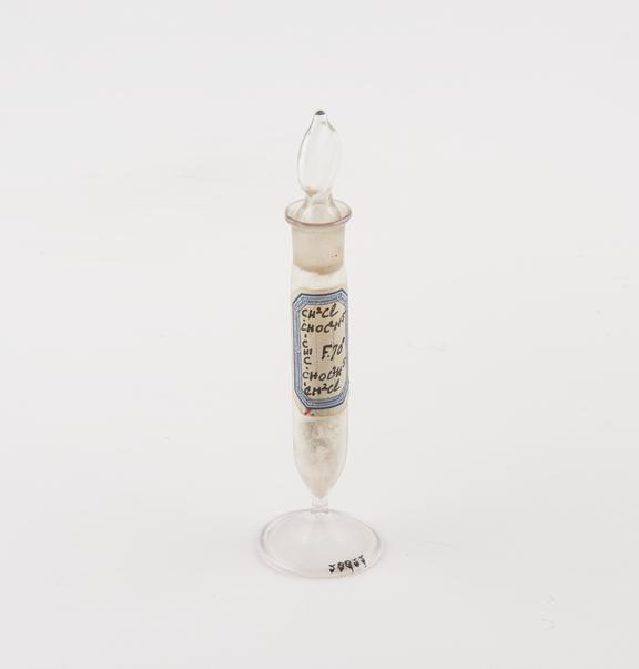 Glass specimen vial with glass stopper containing chloromethyl