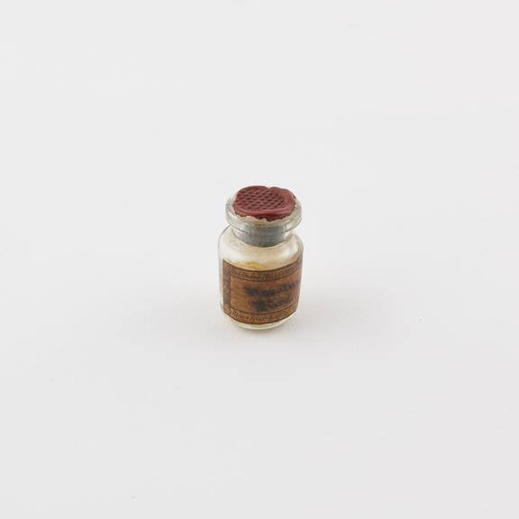 Glass vial with cork stopper sealed with wax