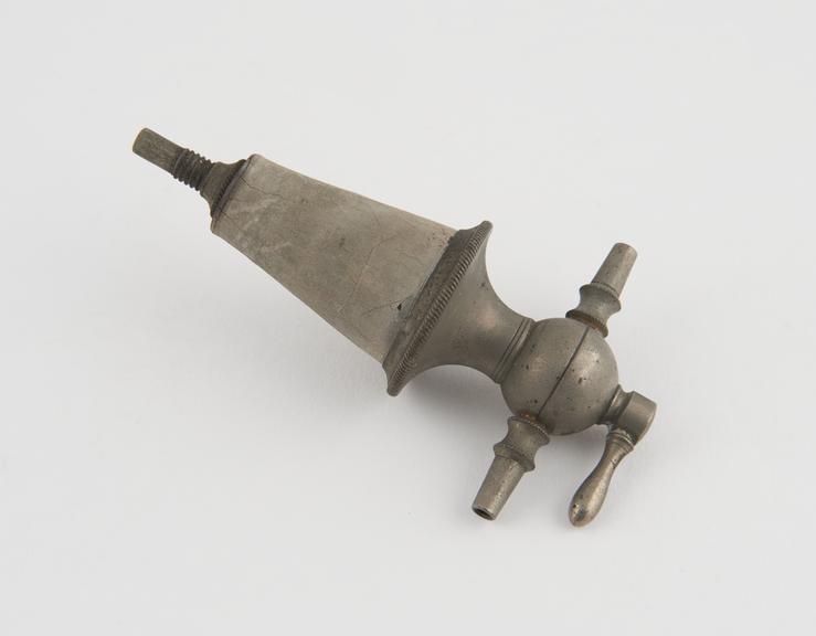 Stopcock, steel and rubber, late 19th century