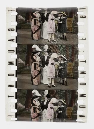 Three frames of silent 35mm stencil colour positive film