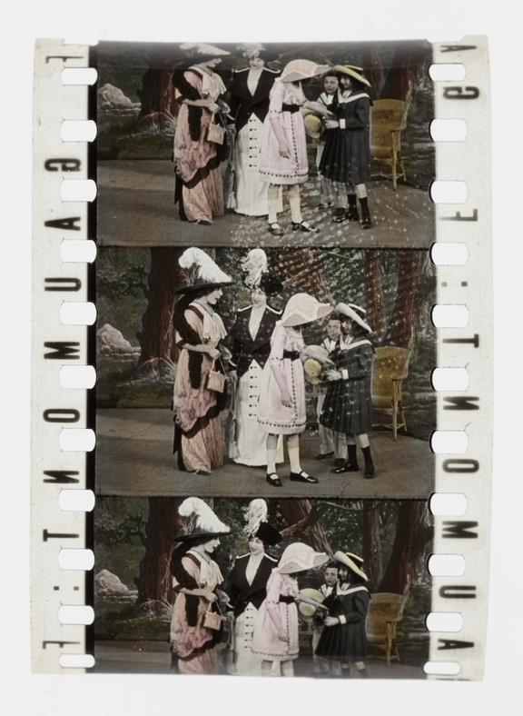 Three frames of silent 35mm stencil colour positive film