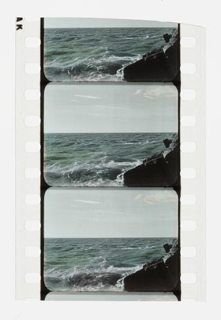 Two and a half frames of silent 35mm stencil colour positive film