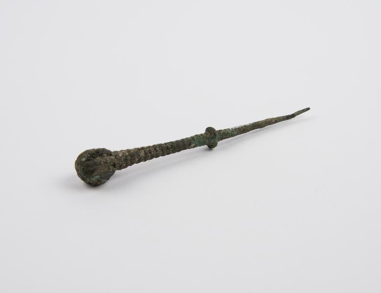 Dental stopper(?), bronze, with ridged handle, Graeco-Roman(?)