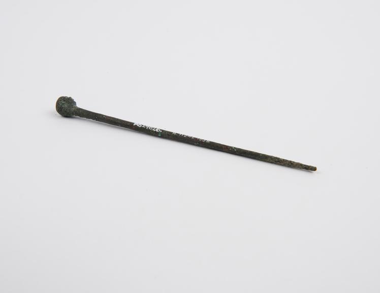 Hairpin, bronze, decorated with boy's head, Roman