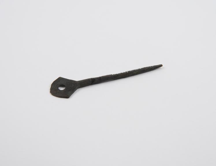 Pin, bronze, with fenestrated decorative head, found in London