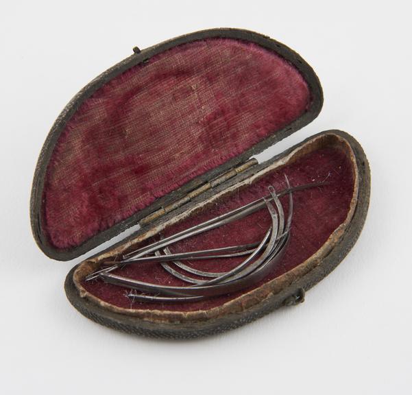 9 suture needles, steel, in fishskin case, 19th century