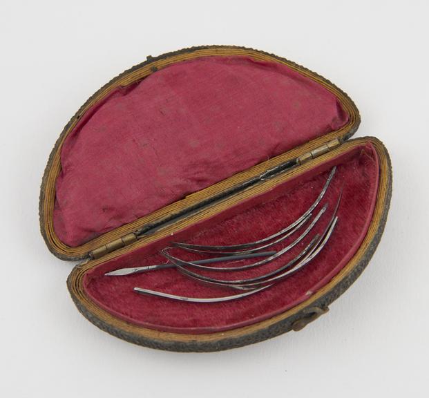 7 suture needles, steel, in fishskin case, 19th century