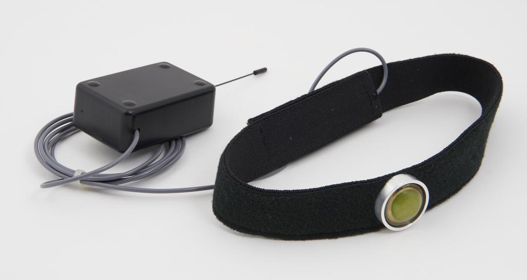 Sound sensor in throat strap with electronic control unit