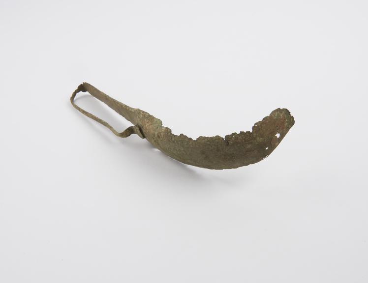 Bronze strigil, decorated possibly inscribed handle