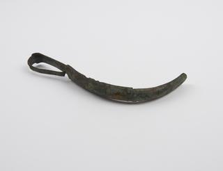 Bronze strigil with curved blade and flat looped handle