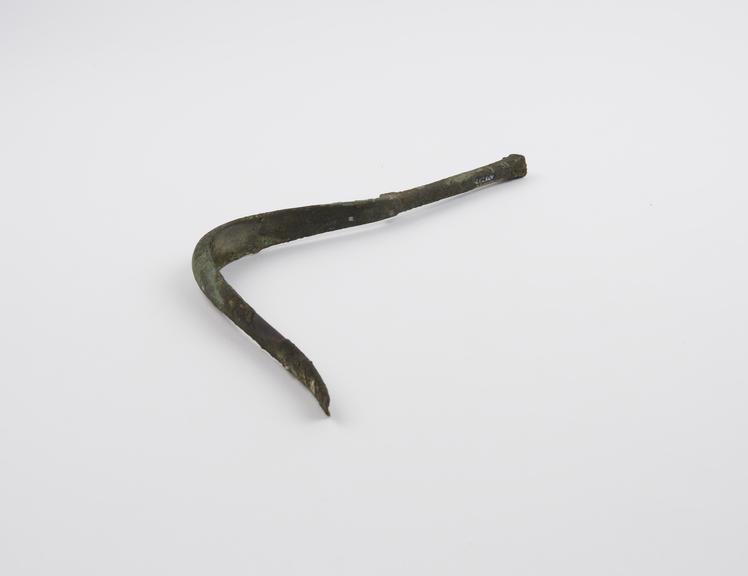 Bronze strigil, curved blade and solid handle, Roman, 1-400AD