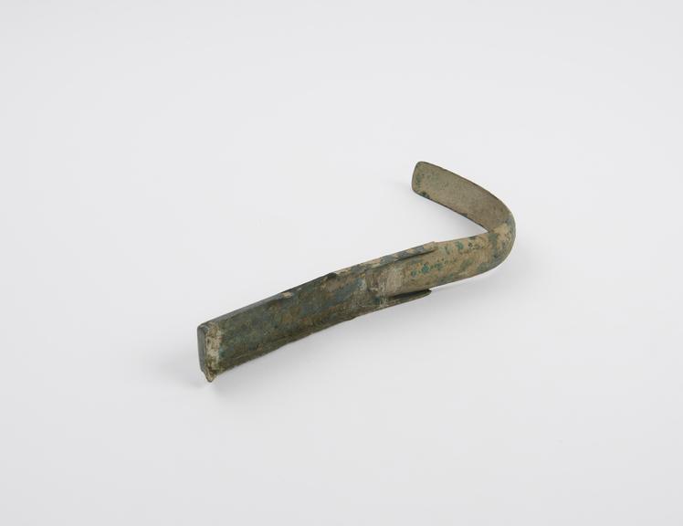 Bronze strigil with curved blade and flat handle, Roman, 1-400AD