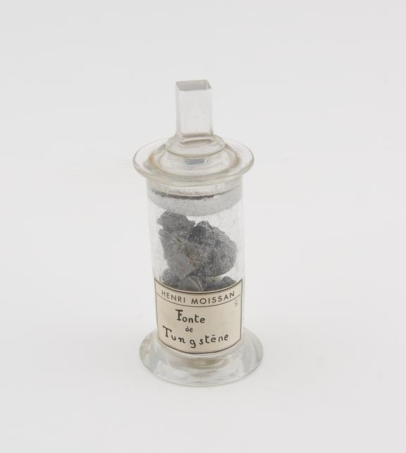 Font de tungstene in a specimen jar with glass stopper