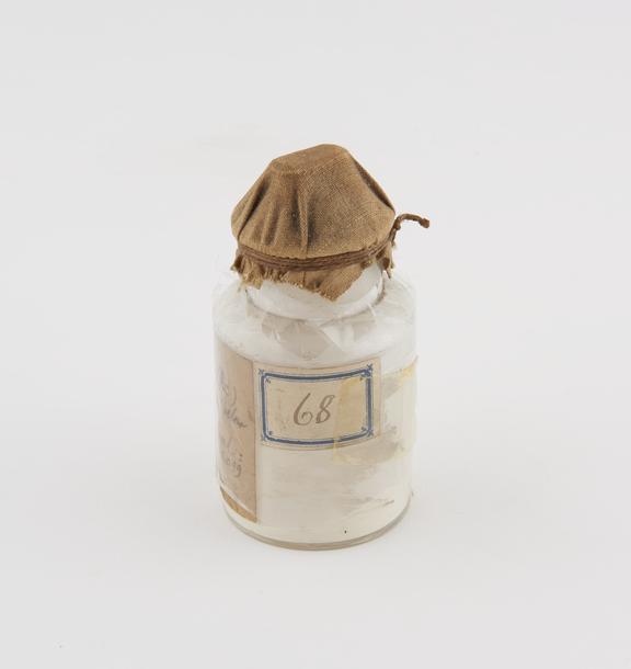 Glass stoppered jar containing compound (Kerasine, ox)