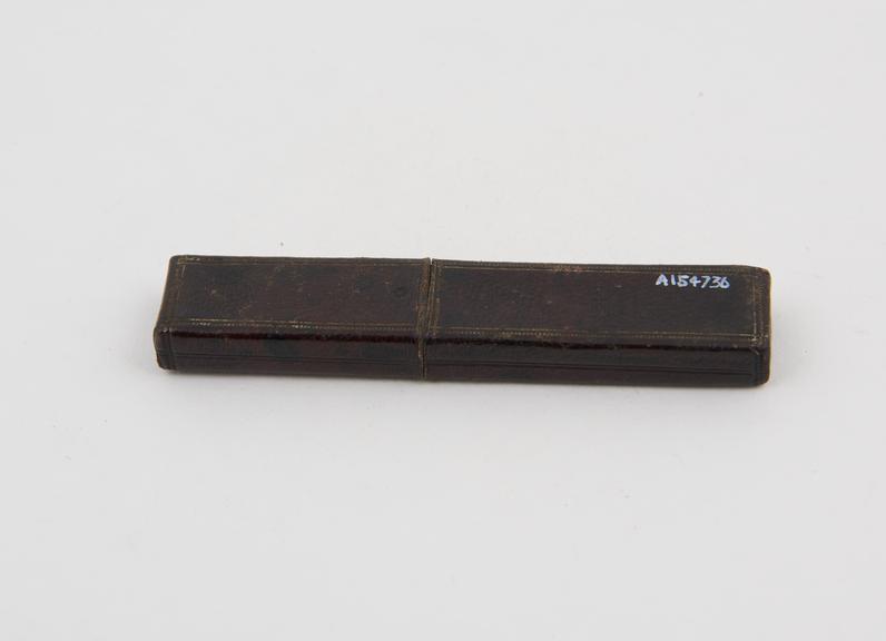 Gum lancet, steel, in tortoiseshell sheath, in leatherette case