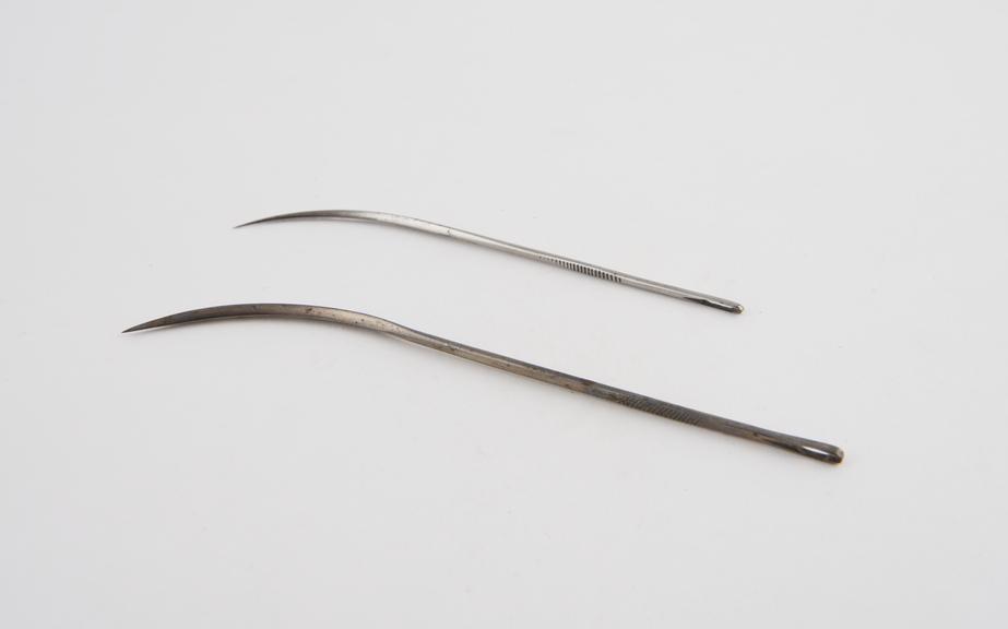 2 half-curved suture needles, steel, British(?), 1901-1930