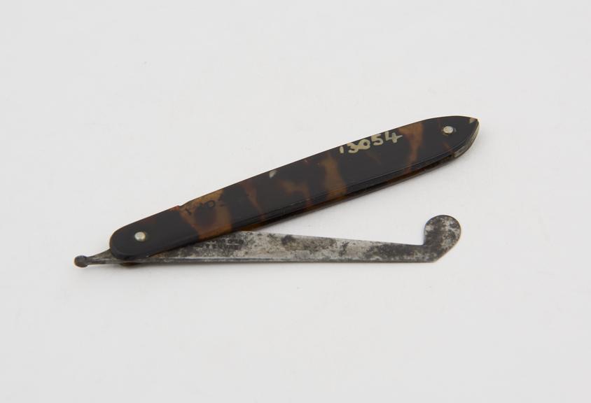 Gum lancet, steel, folding, angled head, in tortoiseshell case