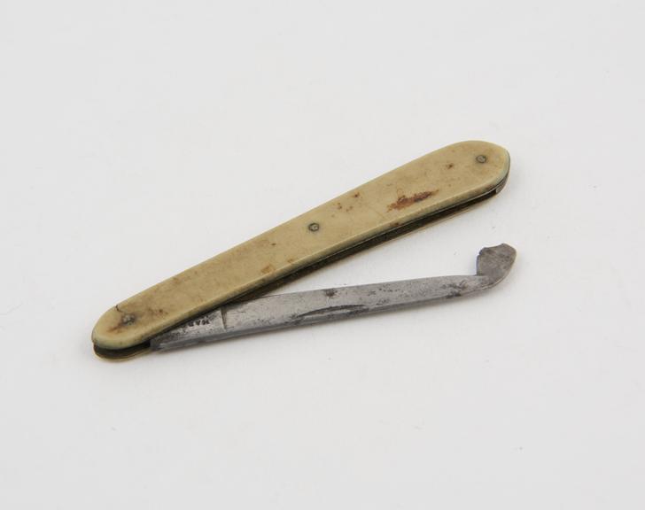 Gum lancet, steel, folding, angled head, in ivory sheath