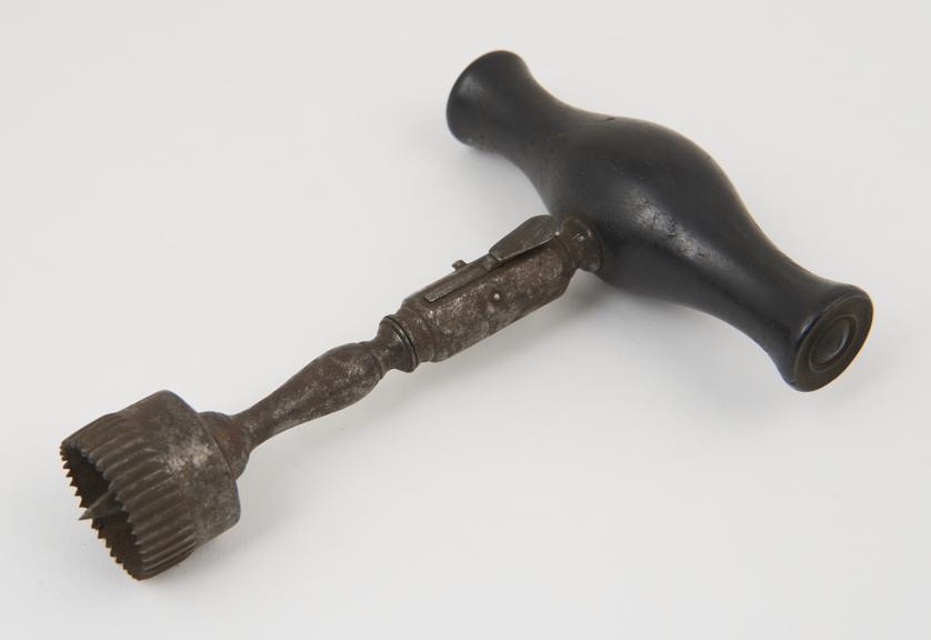 Cranial trephine with wooden handle