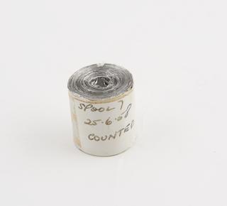 Spool 7 of aluminium rainfall record tape, counted, unsigned, United Kingdom, dated 25 June 1958