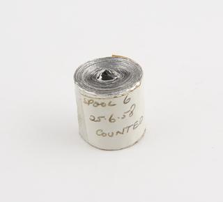 Spool 6 of aluminium rainfall record tape, counted, unsigned, United Kingdom, dated 25 June 1958