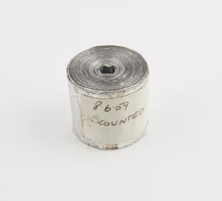 Spool, two of two, of aluminium rainfall record tape, unsigned, United Kingdom, dated 8 June 1959