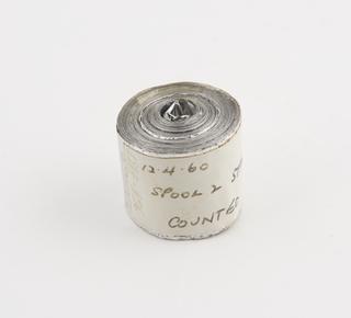 Spool 2 of aluminium rainfall record tape, unsigned, United Kingdom, dated 12 April 1960