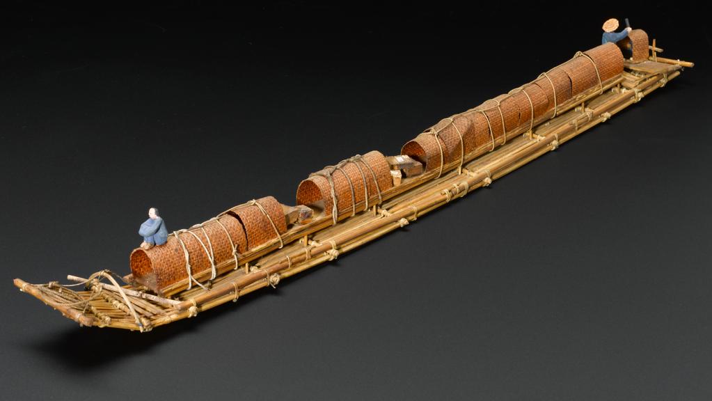 Model of a Chinese bamboo raft with long narrow bamboo platform