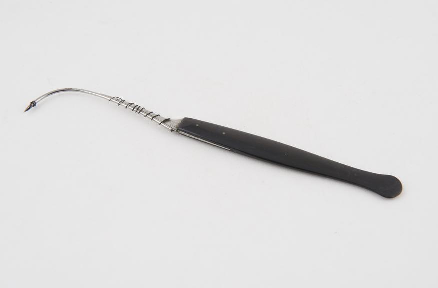 Vaginal fistula needle, steel and ebony, by Evans and Co