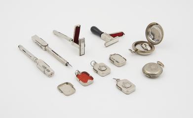 Selection of metal fountain pens, ink pads and stamps