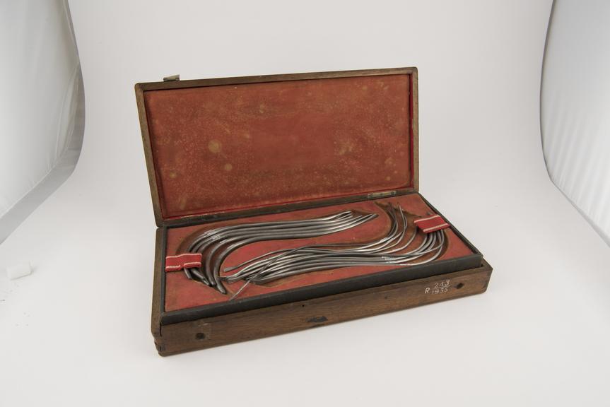 Set of pewter copies of 28 urethral sounds in wooden case