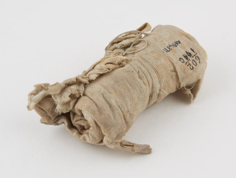 Roll of white lint dressing from dispensary of H.M.S