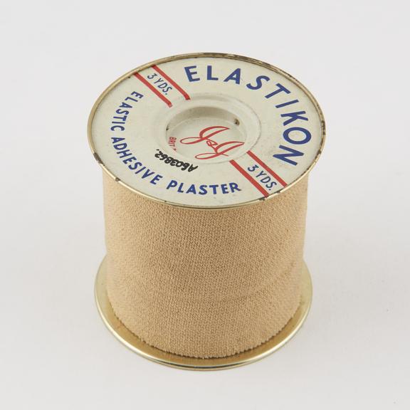 Roll of elastic bandage on former, c