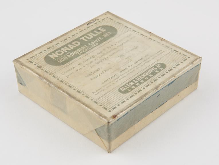 Cardboard box, sealed by cellophane, sterilized gauze net