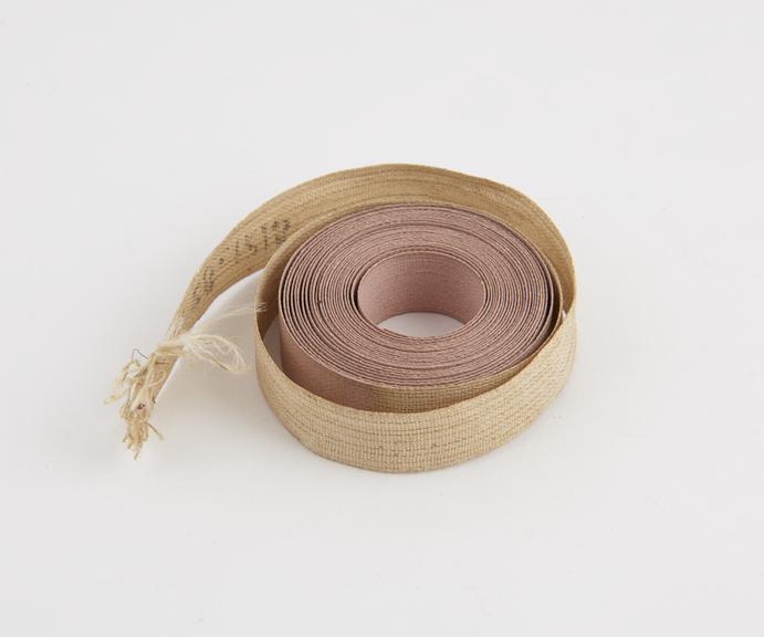 Sample of wired-linen used in making measuring tape, by J