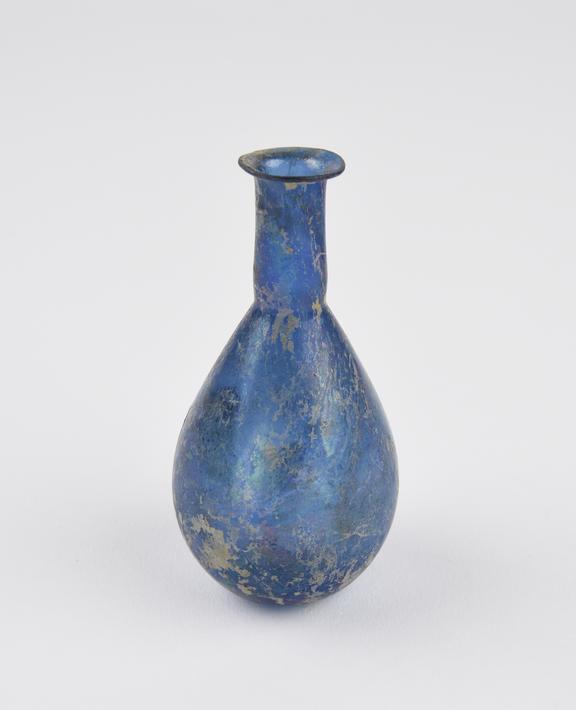 Glass flask, dark blue, conical body, concave base