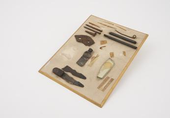 Collection of metal foreign bodies mounted on card