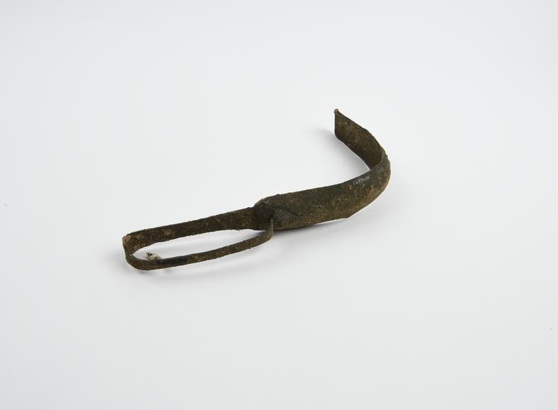 Bronze strigil with curved blade and flat looped handle