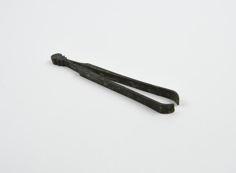 Metal copy of forceps, original bronze and Roman, European