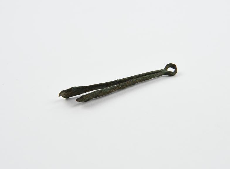 Depilatory(?) forceps, bronze, damaged and encrusted, Roman(?)