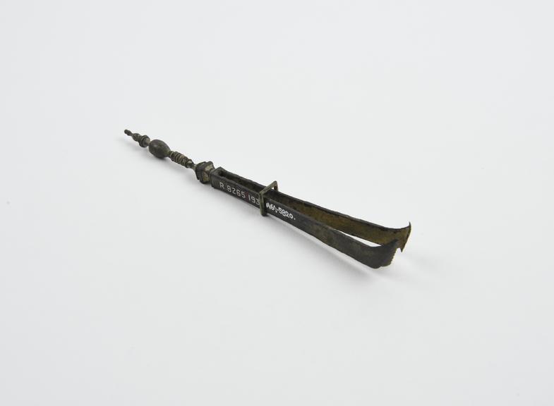 Forceps, with serrated blades, tin, decorated