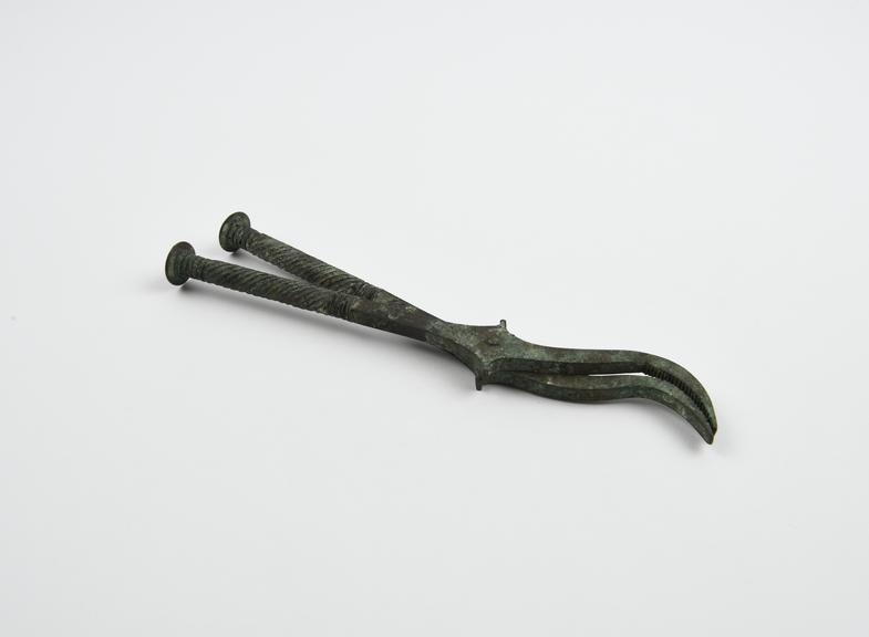 Metal copy of Roman forceps, Herculanensis, original bronze