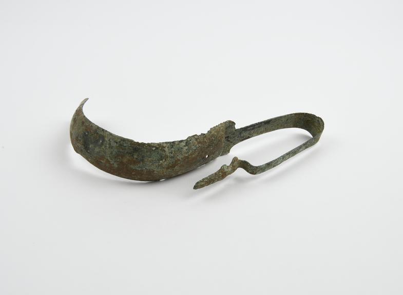 Strigil, bronze, Greek, engraved design on handle