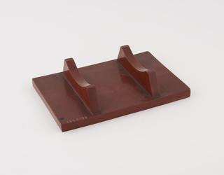 Stand for motor car lighting dynamo