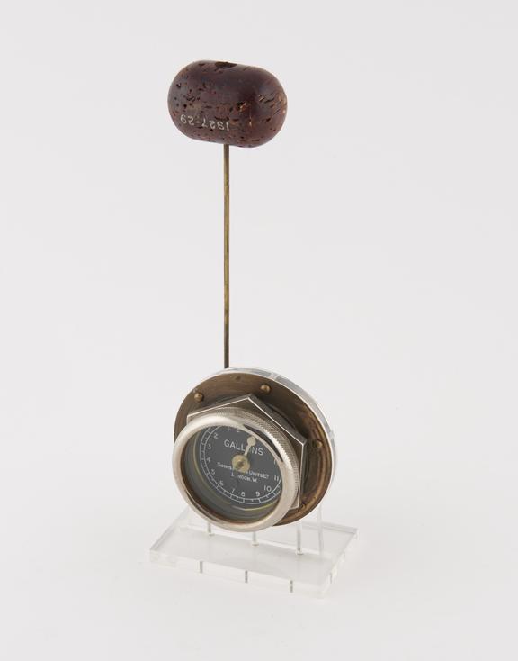 Magnetic petrol gauge with cork float and dial indicator