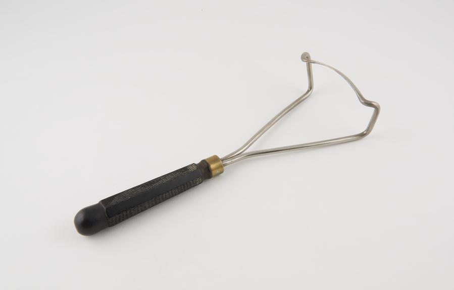 Retractor, steel and ebony, with brass ferrule