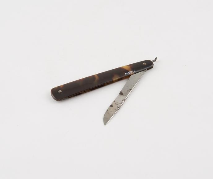 Scalpel, steel and tortoiseshell, by Simpson of London